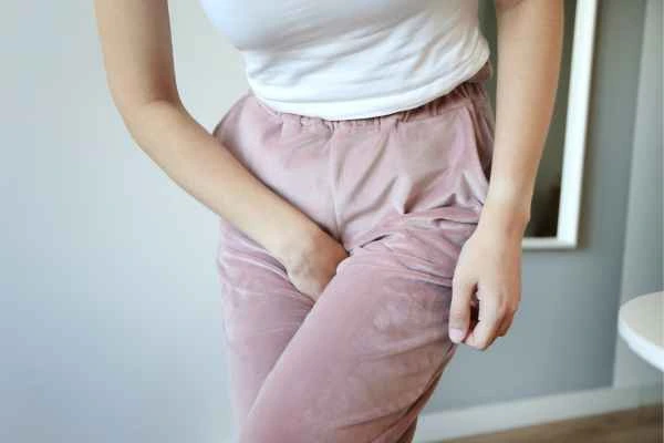 woman running for the toilet because of urinary incontinence Bournemouth